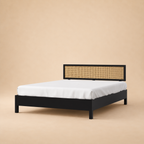 California Black Rattan Bed - Mango Wood — warm beige studio view