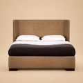 Agastya upholstered bed — warm beige studio view