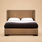 Agastya upholstered bed — warm beige studio view